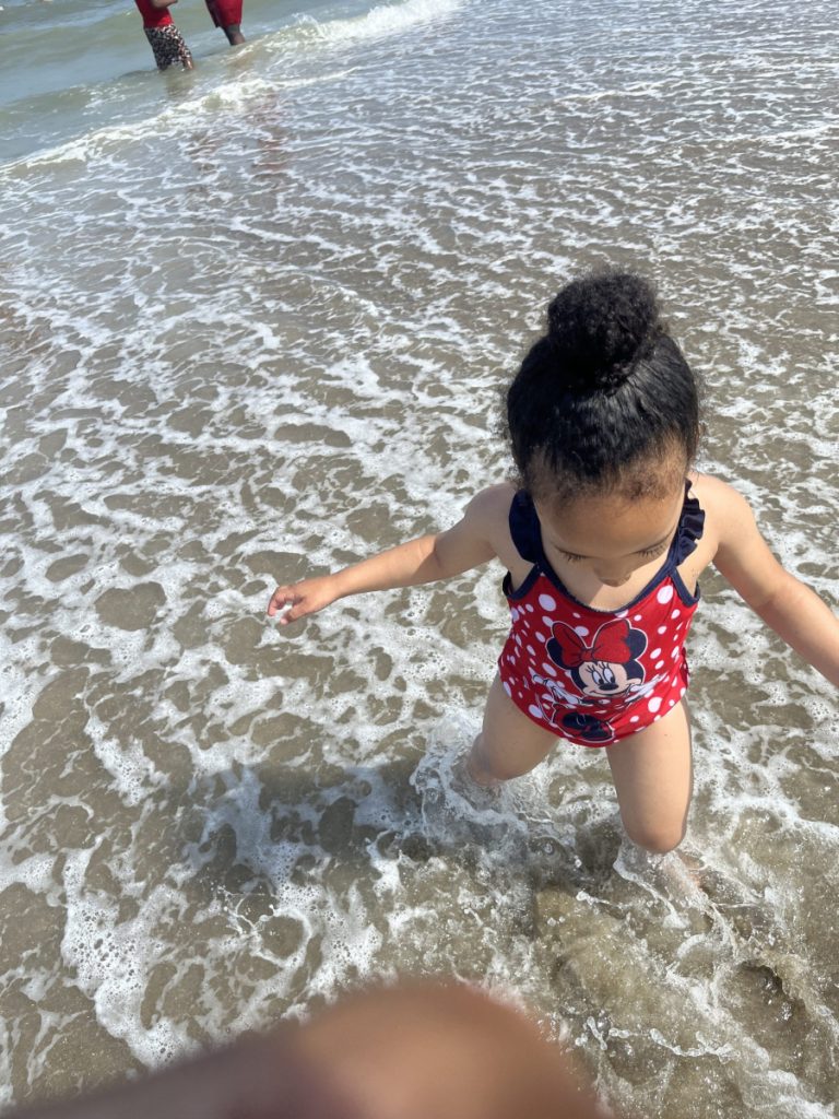 Little girl in beach water